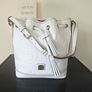 Authentic white Dooney &Bourke monogam embossed leather bucket bag